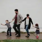A family of four walking on a sidewalk in Clarksville TN