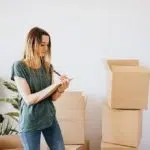 a woman packing for moving house