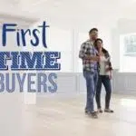 Happy first time home buyers, standing in their new home in Clarksville TN.